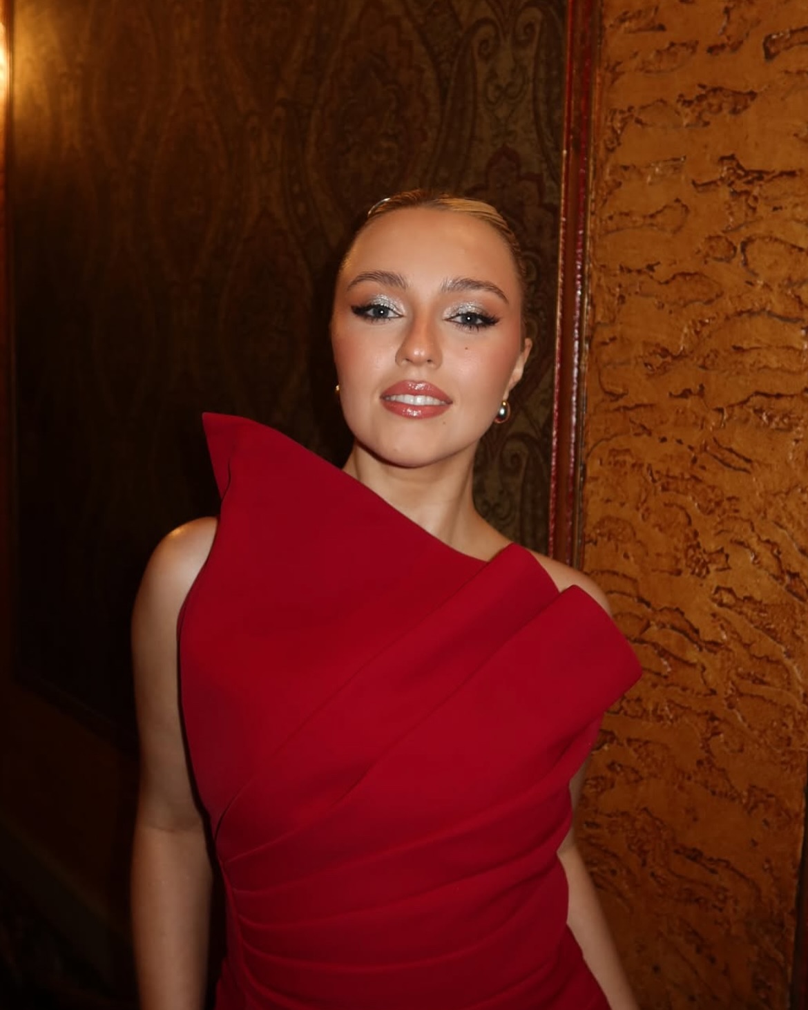 She’s not just wearing red—she’s owning it