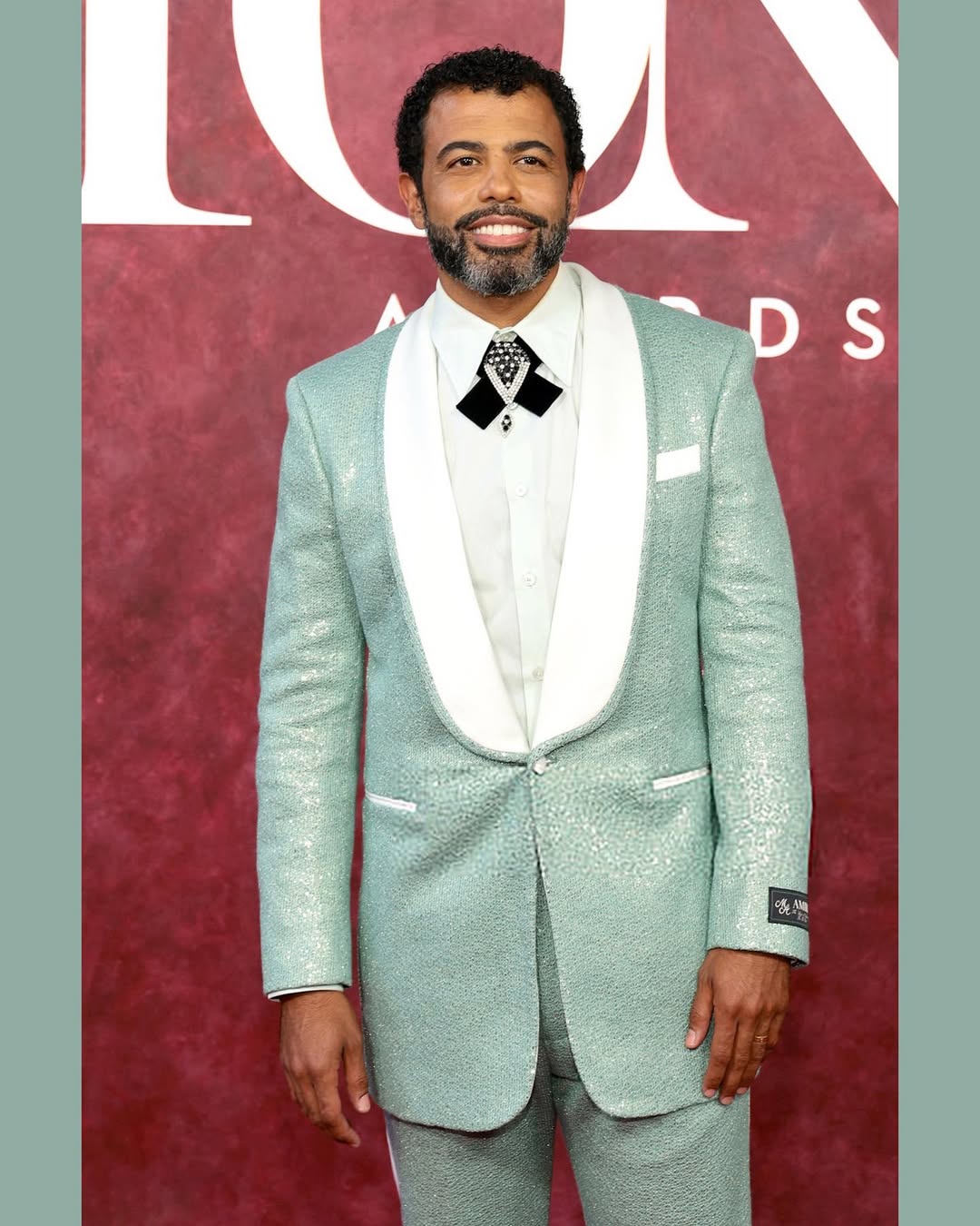 DAVEED @daveeddiggs in AMIRI by MIKE AMIRI + The 78th annual TONY AWARDS @thetonyawards at RADIO CITY MUSIC HALL (6.8.2025). A REUNION, to celebrate the 10th anniversary, the original cast of the mega hit musical LIN MANUEL MIRANDA’s HAMILTON @hamiltonmusical came together and performed live tonight during the awards festivities. DAVEED walked the carpet tonight (with his wife, fellow HAMILTON alumni, actress EMMY RAVER-LAMPMAN) wearing a tuxedo look (including shirt and loafer), all by AMIRI by MIKE AMIRI @amiri @mikeamiri; vintage brooch from DECO JEWELS @decojewels @evanpazol (worn as a custom bow tie); Patrimony self-winding 40mm white gold watch by VACHERON CONSTANTIN @vacheronconstantin @teamfka Styling by DAVEED and @johntanstyling Tailoring by LARS NORD @larsnordstudio Hair by NAI’VASHA @naivashaintl Grooming by @emilyamick Special thanks to DAVEED, as always…MIKE AMIRI, AMINATA BA, ANTONIO WRIGHT, ANTHONY PUR and OMAR HABIBEH for their support; LARS NORD and his wonderful team at LARS NORD STUDIO; MARCELO CHEN at FKA AGENCY; the team at VACHERON CONSTANTIN and EMILY AMICK for her grooming. Congrats to the CAST of HAMILTON for an amazing performance and all the TONY WINNERS and NOMINEES for a incredible BROADWAY SEASON. #actor #reunion #performance #decade #awards #theater #broadway #fashion #redcarpet #appearance #hamilton #thetonys #americantheatrewing #daveeddiggs @brooksideartistmanagement @emilygersonsaines @tessyc11 @maxburbey