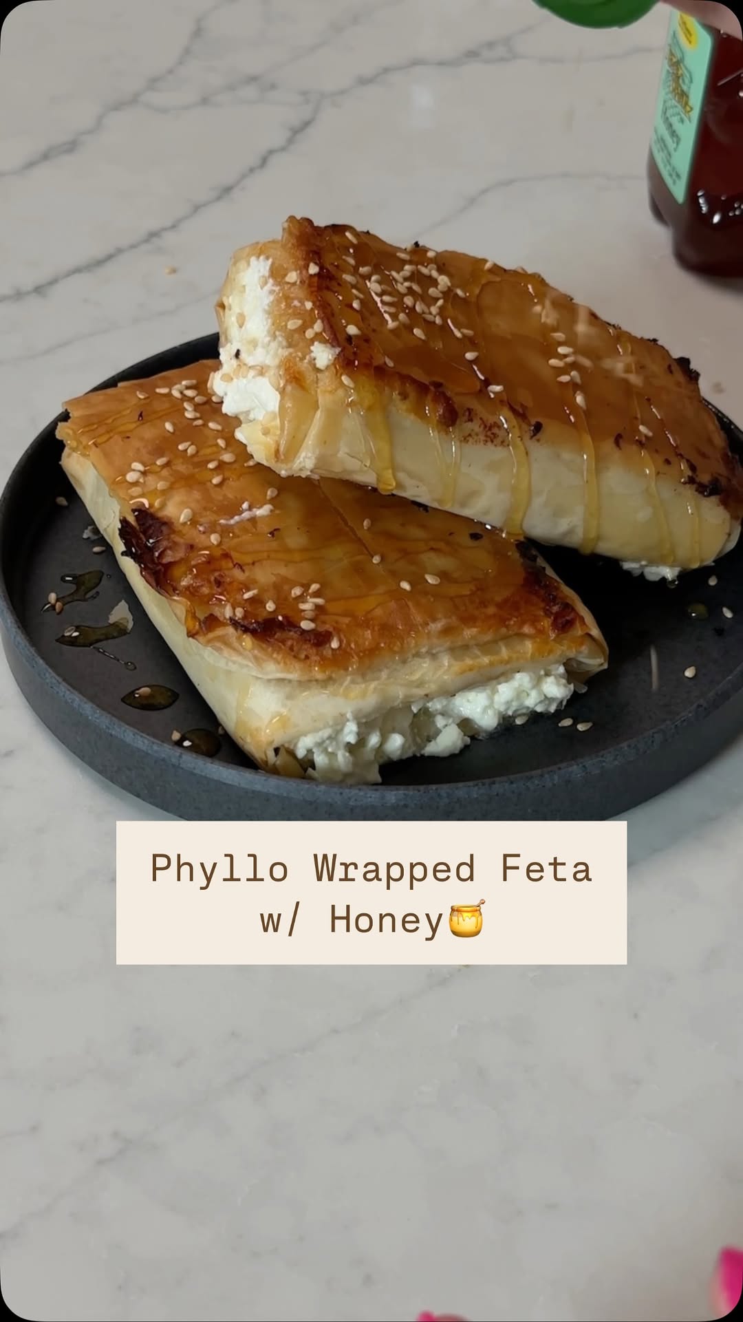 Guys… feta is one of my favorite foods ever so if you feel the same this simple recipe is GIVING and you have to try!!!
Phyllo Wrapped Baked Feta With Honey
Inspired by @themediterraneandish ✨
2 blocks of feta— 4oz each
Phyllo dough, thawed
Honey
Sesame Seeds
Preheat your oven to 350 degrees. Unwrap your phyllo dough and spread it carefully on a clean surface or cutting board. Brush the surface of the phyllo dough with olive oil, then add one of the feta blocks to the phyllo towards the bottom closest to you. Fold the sides to almost cover the cheese. Then brush the phyllo with olive oil again. Continue to fold the phyllo around the feta until completely folded. Repeat with the 2nd block of feta and remaining phyllo dough sheets. Brush the top of both wrapped phyllo blocks with more olive oil and then arrange them seam side down on a nonstick baking sheet. Bake them in the oven for about 20 minutes, until the phyllo is golden and crispy on both sides. Once it’s done, remove it from the oven very carefully and transfer to the serving plate! Drizzle with honey and sprinkle with sesame seeds. Serve and enjoy!!!!!
PS. I used too much feta and it came out the sides so use only 4oz instead of a whole block for each!
