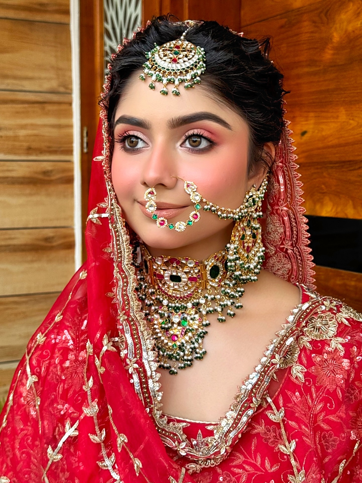 A dreamy, flushy-glowy bridal look featuring radiant, cream-based skin with a luminous finish. The cheeks bloom with fresh pink tones, giving a natural bridal flush. Eyes are kept soft and romantic, defined with generous coats of mascara instead of falsies, enhancing the lashes for an open, fluttery gaze. Lips are kept creamy and nude, balancing the look with effortless elegance. Altogether, the makeup radiates a soft, ethereal charm—perfect for a bride who wants to feel naturally beautiful and timeless.
..
Makeup : @satpreetkaurmakeovers
Hair : @hairbyharrybajwa
Jewellery : @glamutsav
Wearing Label : @ridacouture5