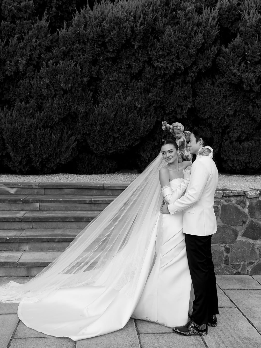 Indonesian actress @amandarawles and her partner Adriel wed at Mona Farm in Braidwood, NSW, following a romantic proposal in Lake Como. Planned by Bow Creative, the wedding balanced high fashion with heartfelt details featuring a custom Hian Tjen gown, dramatic florals by Ellebore, and a moody reception with candlelight, hand-painted menus, and an oyster bar. A last-minute weather change led to an intimate ceremony in a hidden grove, while entertainment by Tobi Tobi Co and Silent Shout set the tone for a day that felt stylish, emotional, and deeply personal.
Photographer: @mervetogan
Videographer: @luca.zarik
Content Creator: @mtl.socials
Venue: @monafarm_
Planner & Stylist: @_bowcreative
Dress designer: @hiantjen
Fashion Stylist: @astecat
Accessories, shoes and veil: @metier and @jimmychoo
Partner’s attire and accessories: @wonghangtailor and @prada
Florist: @_ellebore
Stationery: @peggyandpolly_
Draping: @thelooksydney
Hair and makeup: @archangelachelsea and @bridalglowco
Catering and cake: @simonekascatering and @mysweetlady_cbr
MC: @withlovemcjess
Celebrant @nataliedrumcelebrant
Ceremony Entertainment : @tobitobi.co
Reception Entertainment: @silentshoutent
Photo Experience: @blanc.portraits