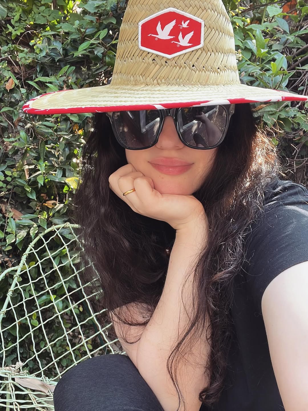 Just a girl sitting on her trash bench in the sun